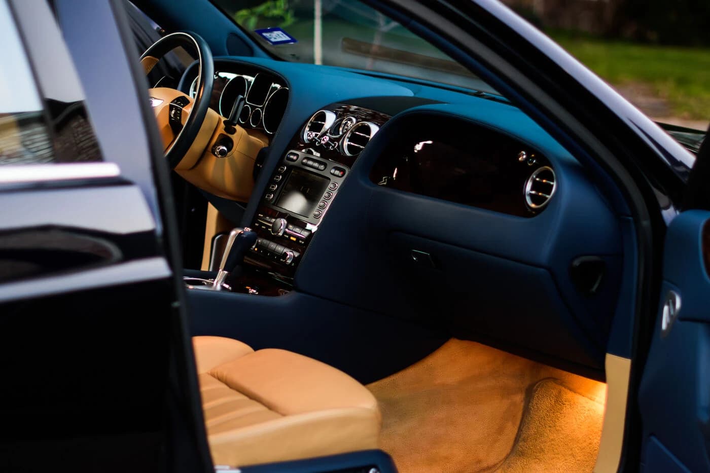 Tan leather interior of a 2008 Bentley Continental Flying Spur, cleaned and conditioned