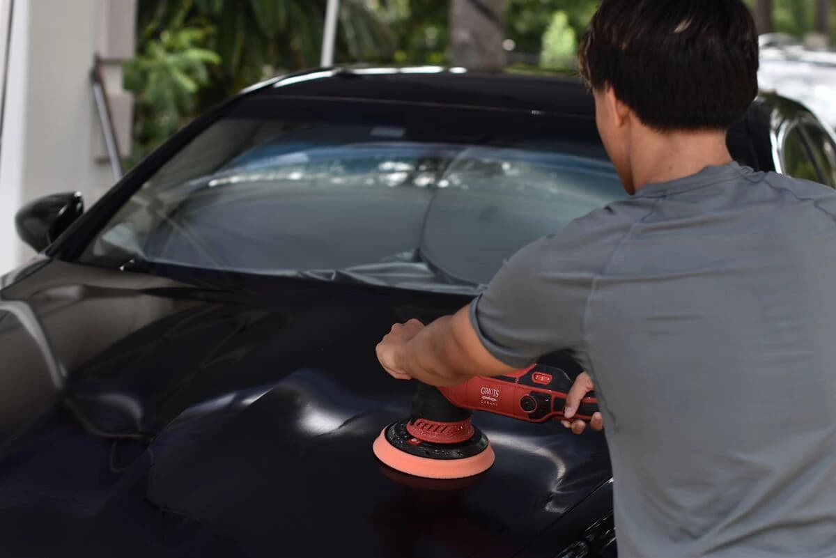 Machine polisher correcting the hood of the LS460