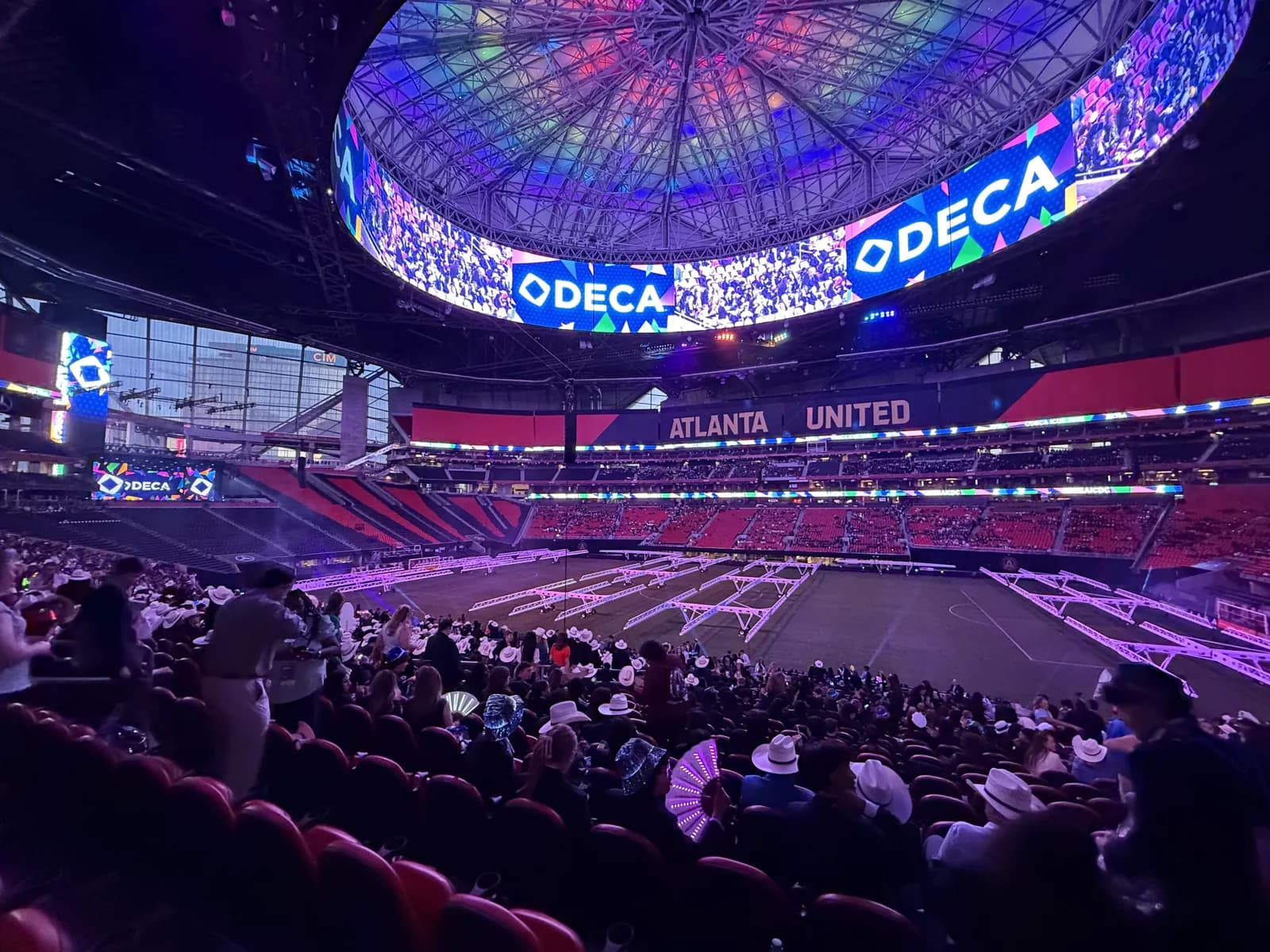 The ICDC 2026 opening session inside the stadium in Atlanta, with DECA on the screens