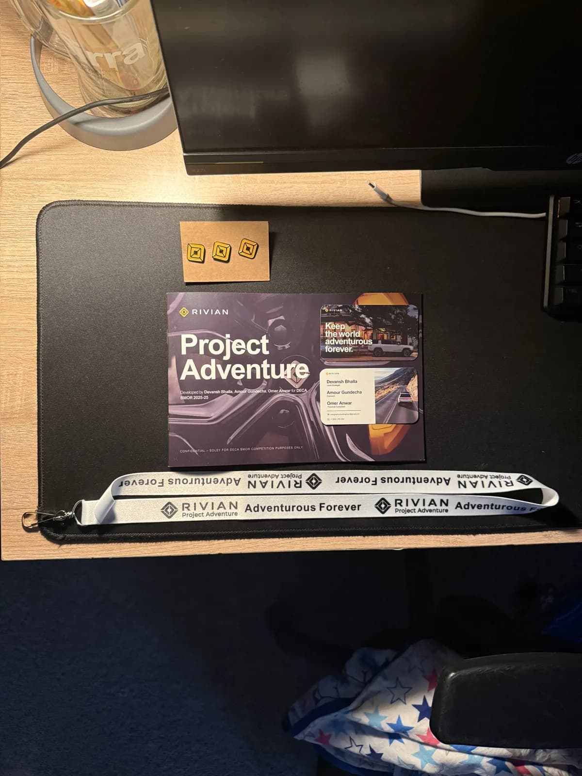 Project Adventure cards and lanyards on a desk