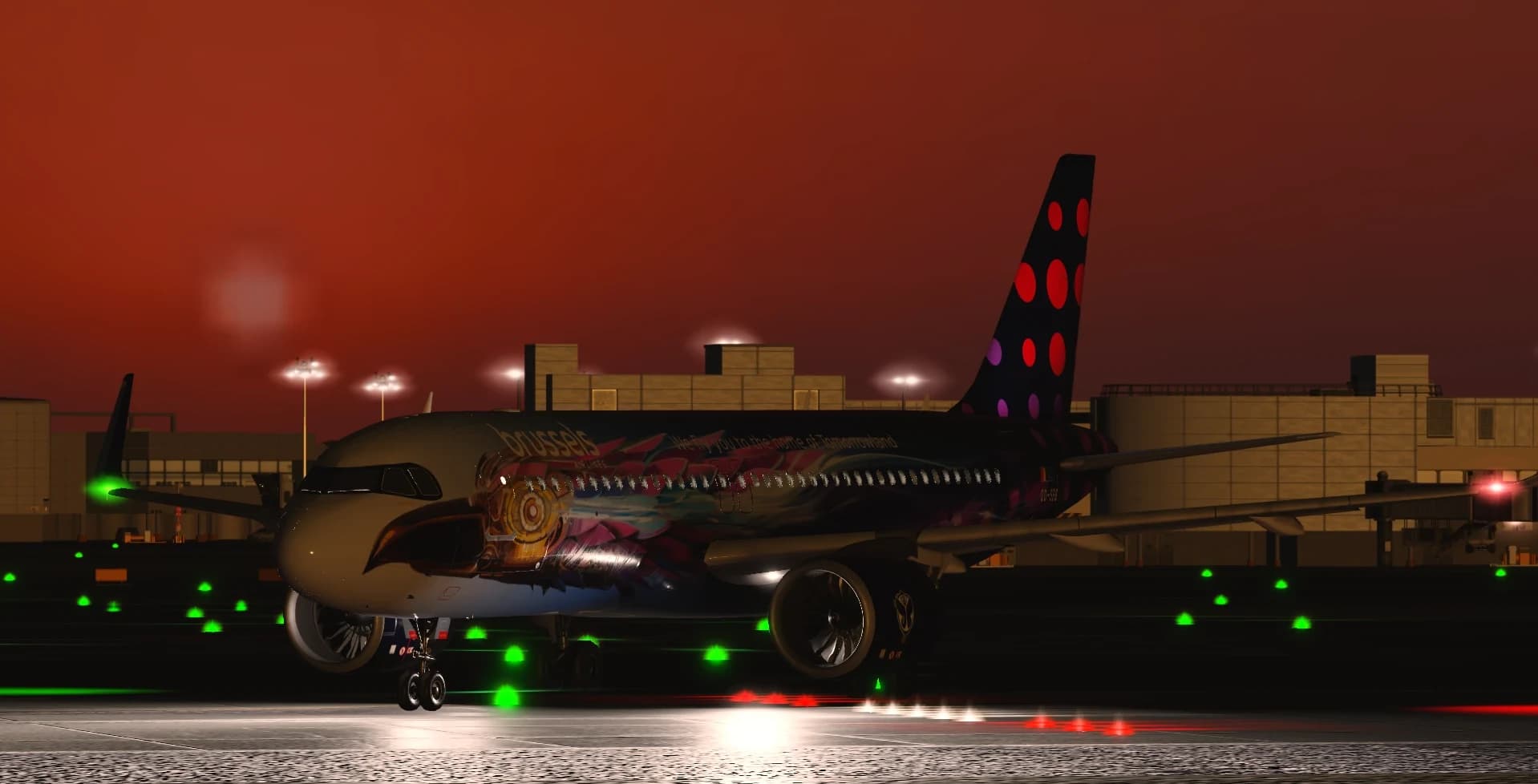 A Brussels Airlines jet in a Tomorrowland livery on a taxiway at dusk