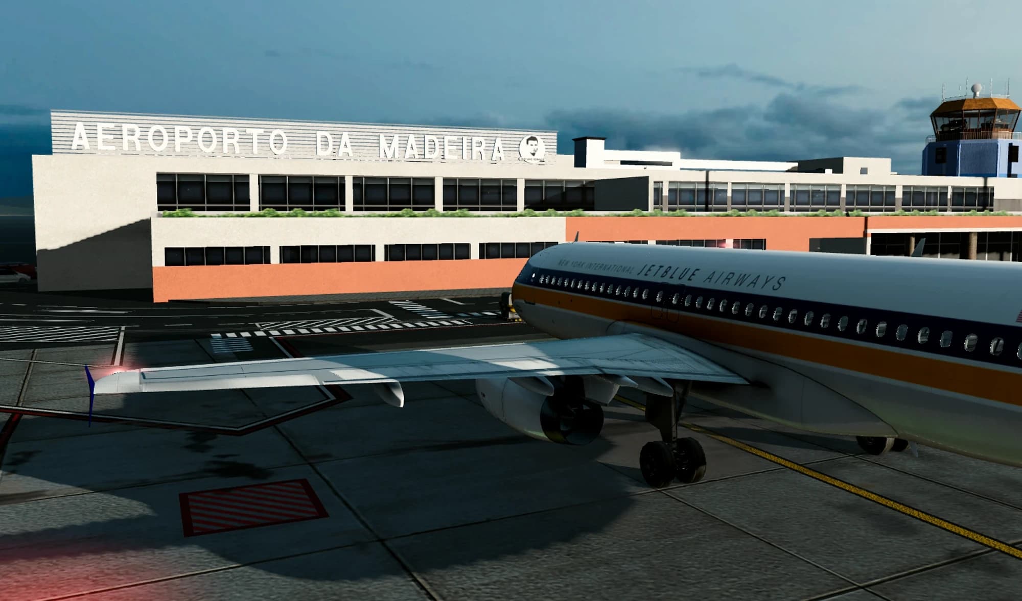 A JetBlue jet in a retro livery parked at Madeira airport